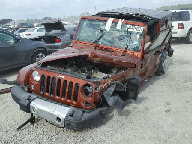 1C4HJWEG3EL221767 - 2014 JEEP WRANGLER U ORANGE photo 2
