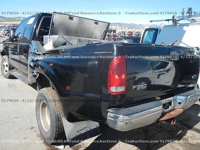 1FTWX33F8XED40243 - 1999 FORD F350 SUPER BLACK photo 4