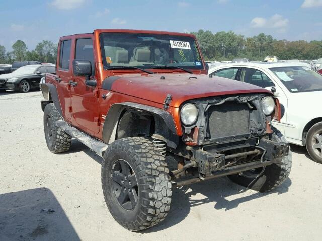 1J4GA591X9L761449 - 2009 JEEP WRANGLER U ORANGE photo 1