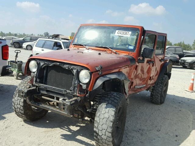 1J4GA591X9L761449 - 2009 JEEP WRANGLER U ORANGE photo 2