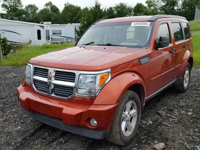 1D8GU58K07W714385 - 2007 DODGE NITRO SLT ORANGE photo 2