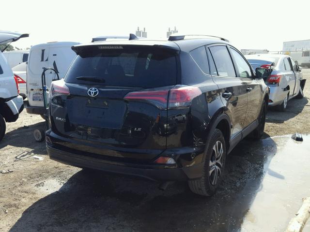 2T3ZFREVXGW261981 - 2016 TOYOTA RAV4 LE BLACK photo 4