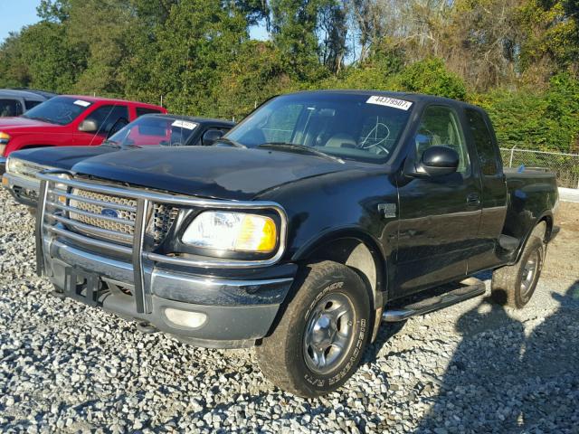 2FTRX08L6XCA87665 - 1999 FORD F150 BLACK photo 2