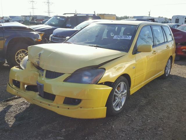 JA3AD69F44U034913 - 2004 MITSUBISHI LANCER YELLOW photo 2