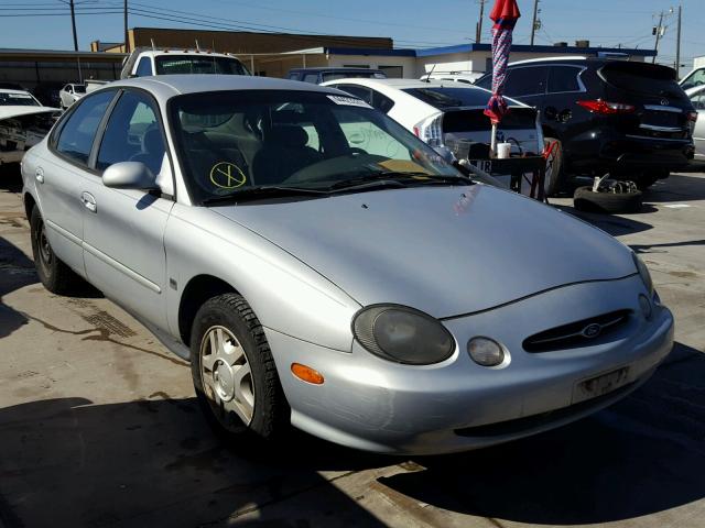 1FAFP53S5XA210989 - 1999 FORD TAURUS SE SILVER photo 1