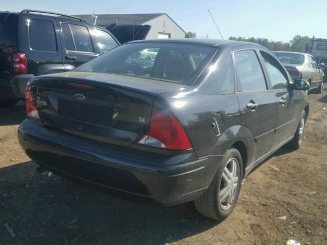 1FAFP34P23W130299 - 2003 FORD FOCUS SE BLACK photo 4