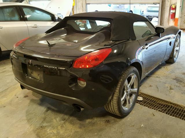 1G2MG35X58Y100309 - 2008 PONTIAC SOLSTICE BLACK photo 4