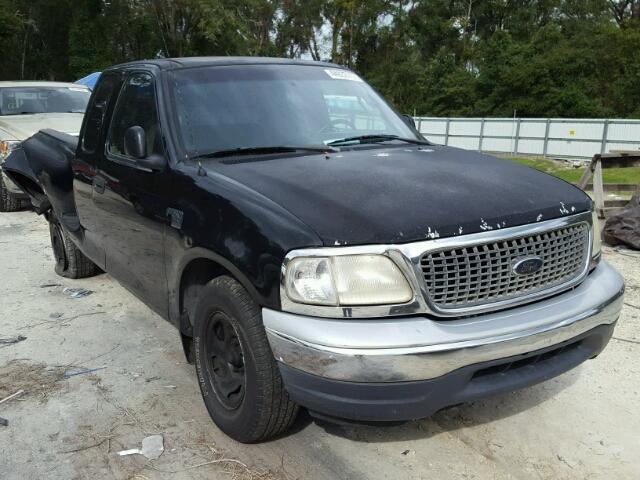 2FTRX07W9YCA27022 - 2000 FORD F150 BLACK photo 1