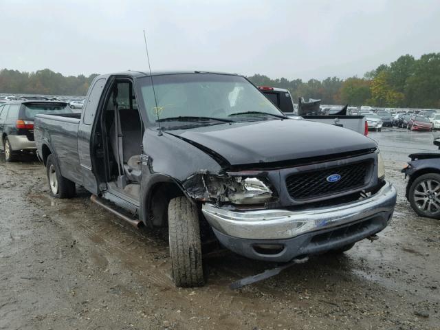 1FTRX18W0YNA23312 - 2000 FORD F150 BLACK photo 1