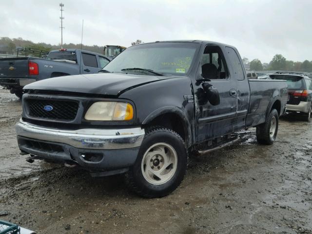 1FTRX18W0YNA23312 - 2000 FORD F150 BLACK photo 2