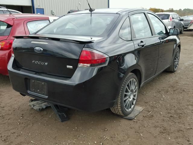 1FAHP3GN9AW261780 - 2010 FORD FOCUS BLACK photo 4