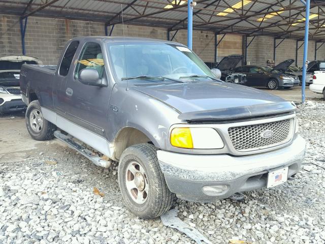 2FTRX18W04CA26081 - 2004 FORD F-150 HERI GRAY photo 1