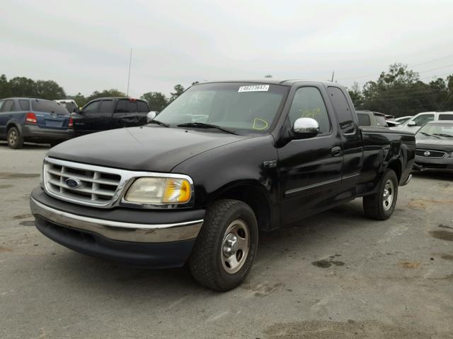 1FTZX1723YNB29963 - 2000 FORD F150 BLACK photo 2