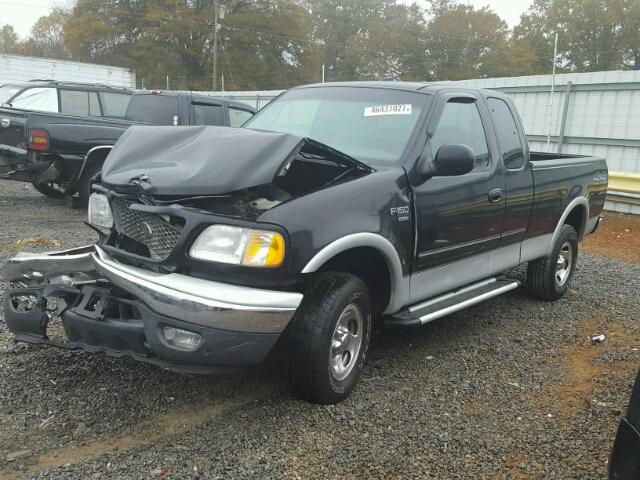 1FTRX18W3YNA48382 - 2000 FORD F150 BLACK photo 2