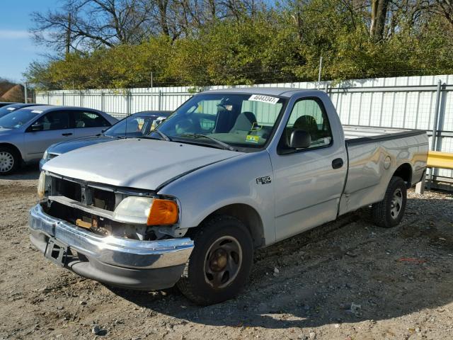 2FTRF17244CA61692 - 2004 FORD F-150 HERI SILVER photo 2