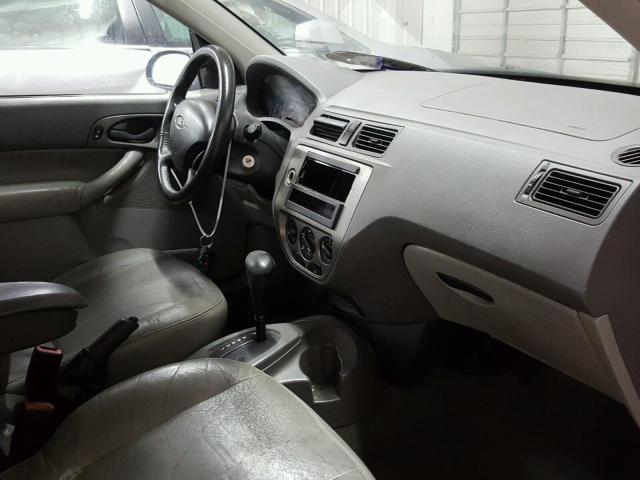 1FAFP34N55W137927 - 2005 FORD FOCUS ZX4 BLACK photo 5