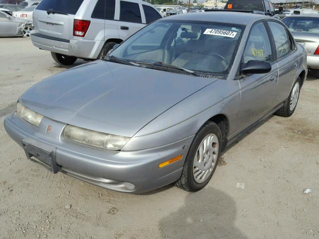 1G8ZK5277XZ262459 - 1999 SATURN SL2 SILVER photo 2