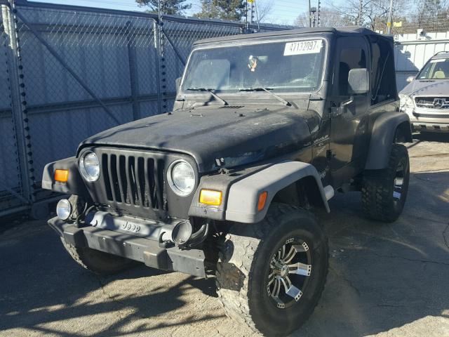 1J4FY19SXXP496823 - 1999 JEEP WRANGLER / BLACK photo 2