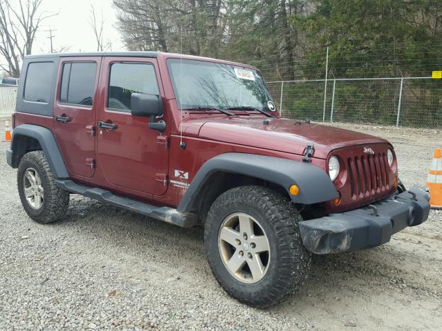 1J4GA39189L769621 - 2009 JEEP WRANGLER U MAROON photo 1