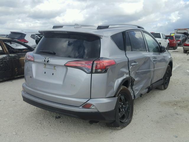 2T3ZFREV4HW395046 - 2017 TOYOTA RAV4 LE SILVER photo 4