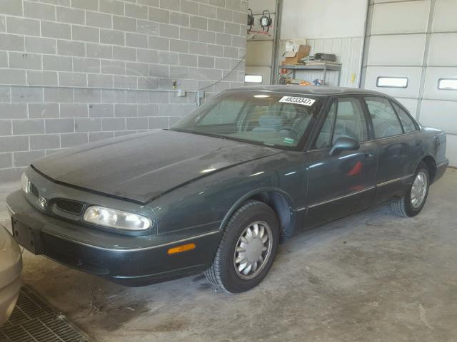 1G3HN52K7V4818387 - 1997 OLDSMOBILE 88 BASE GREEN photo 2