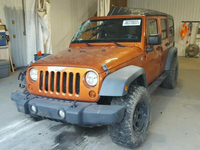 1J4BA3H16BL525581 - 2011 JEEP WRANGLER U ORANGE photo 2