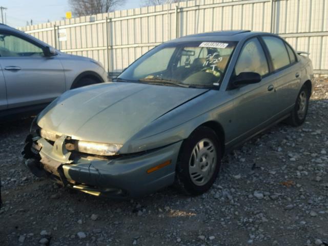 1G8ZK5273XZ282496 - 1999 SATURN SL2 GREEN photo 2