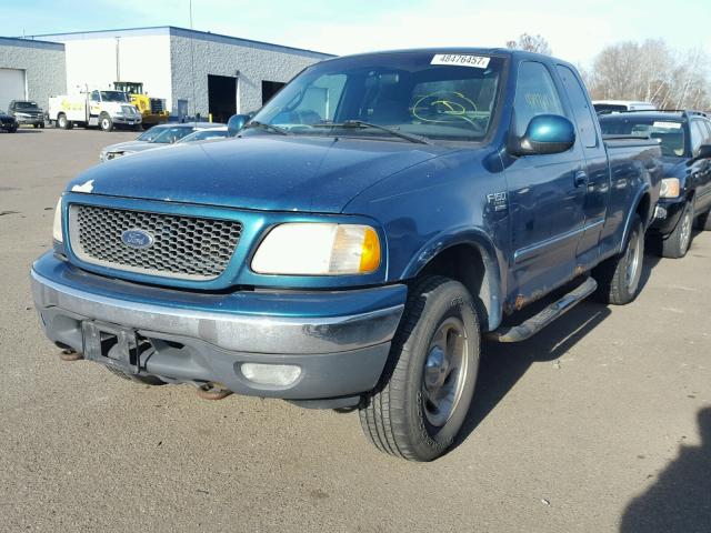 1FTRX18L4YNA66735 - 2000 FORD F150 TEAL photo 2