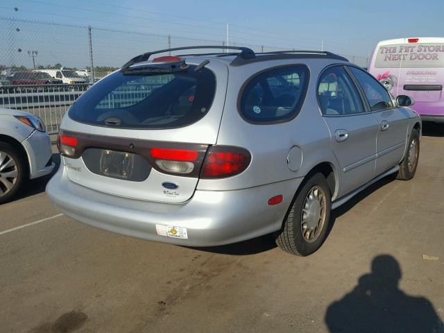 1FAFP58S9XG277021 - 1999 FORD TAURUS SE SILVER photo 4