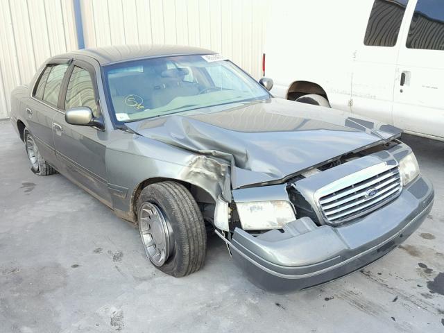 2FAFP74WXXX140183 - 1999 FORD CROWN VICT GRAY photo 1