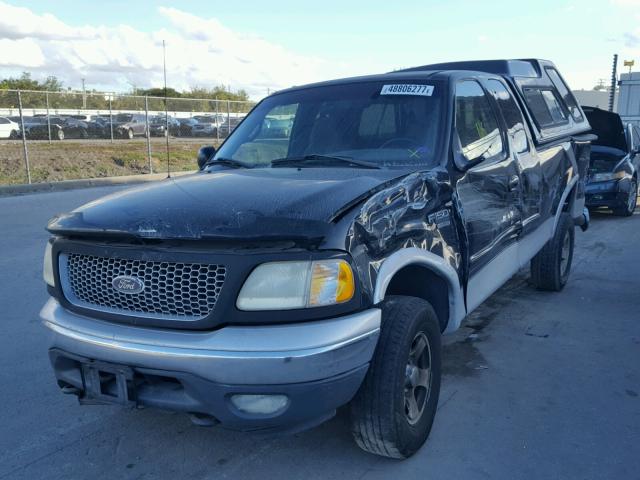 1FTRX18L1YNB48731 - 2000 FORD F150 BLACK photo 2