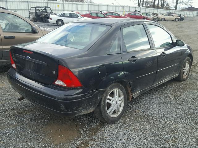 1FAFP3439YW343710 - 2000 FORD FOCUS SE BLACK photo 4