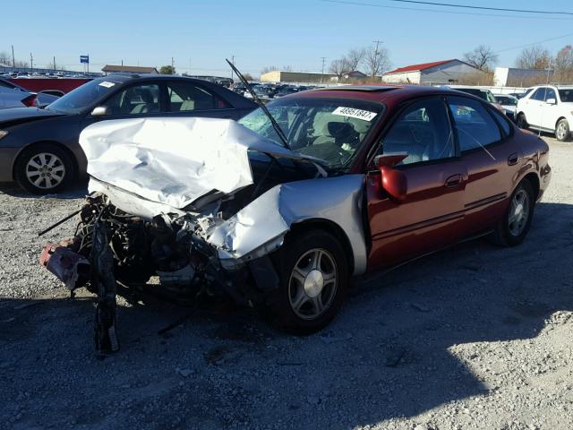 1FAFP53S2XA164067 - 1999 FORD TAURUS SE RED photo 2