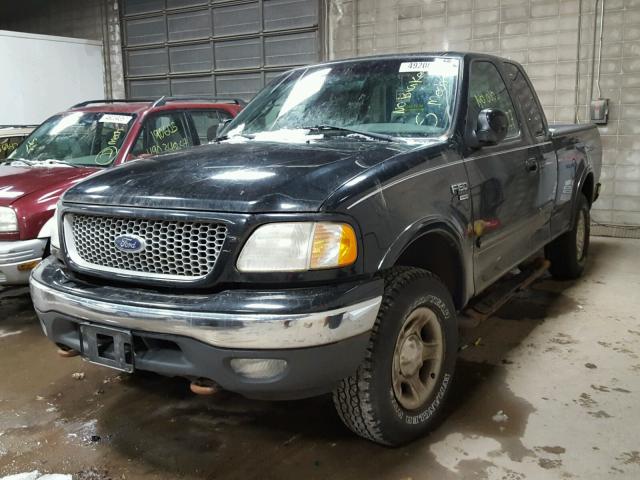 1FTRX18L4XKB86485 - 1999 FORD F150 BLACK photo 2