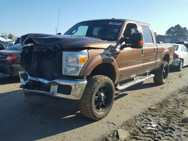 1FT7W2B66BEA15750 - 2011 FORD F250 SUPER ORANGE photo 2