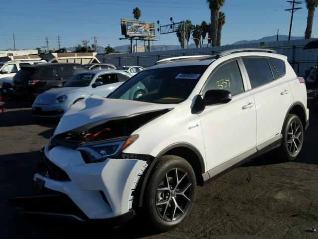 JTMJJREV8JD156226 - 2018 TOYOTA RAV4 HV SE WHITE photo 2