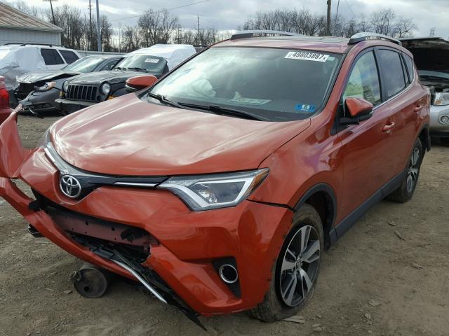 JTMRFREV1GJ076944 - 2016 TOYOTA RAV4 XLE ORANGE photo 2