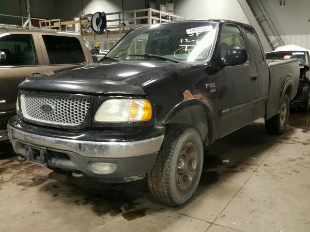 1FTRX18L0XKC00950 - 1999 FORD F150 BLACK photo 2