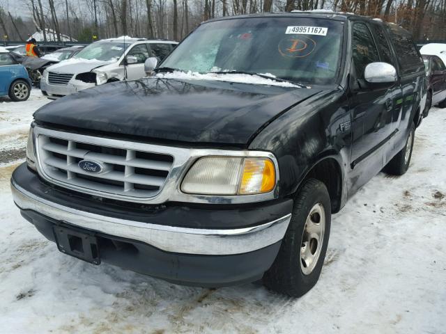 2FTZX1727XCA10706 - 1999 FORD F150 BLACK photo 2