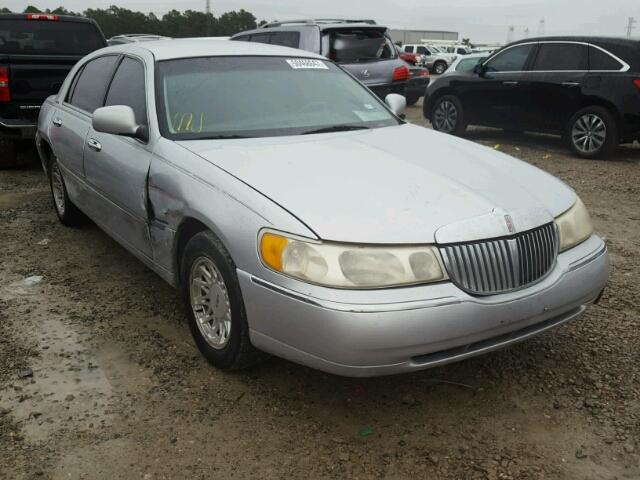 1LNHM82W1XY671143 - 1999 LINCOLN TOWN CAR S GRAY photo 1