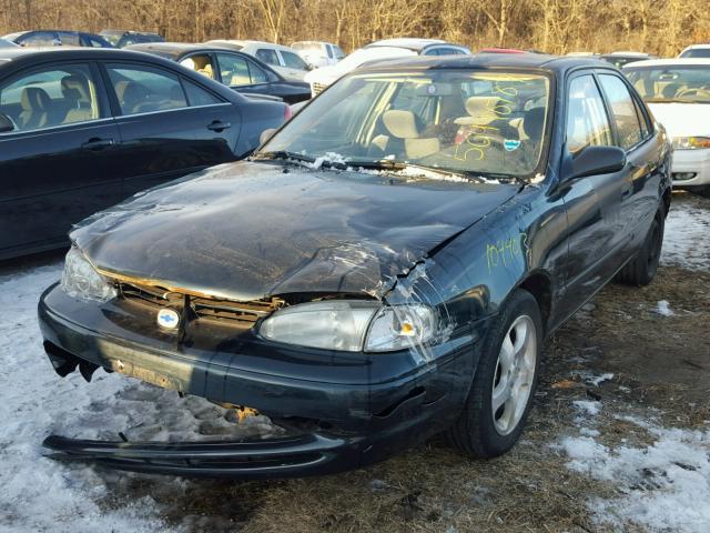 1Y1SK528XXZ434074 - 1999 CHEVROLET GEO PRIZM GREEN photo 2