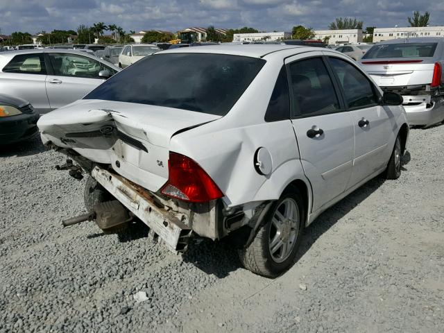 1FAFP34P63W304049 - 2003 FORD FOCUS SE WHITE photo 4