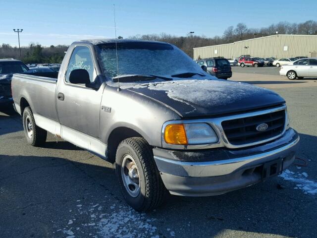 2FTRF17214CA25653 - 2004 FORD F-150 HERI GRAY photo 1