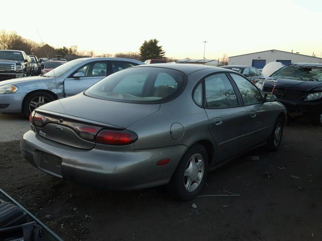 1FAFP53S8XG316530 - 1999 FORD TAURUS SE GRAY photo 4