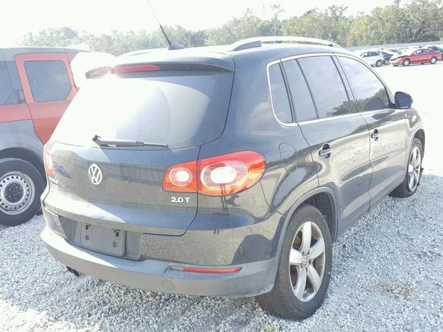 WVGAV7AX0AW520316 - 2010 VOLKSWAGEN TIGUAN S BLACK photo 4