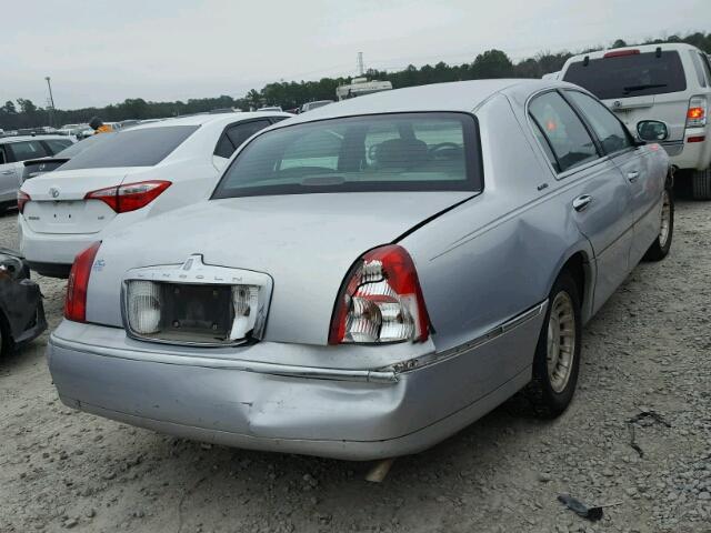 1LNHM81WXXY641429 - 1999 LINCOLN TOWN CAR E SILVER photo 4