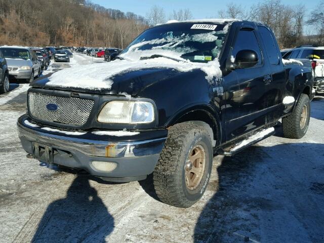 2FTRX08L7XCA00520 - 1999 FORD F150 BLACK photo 2