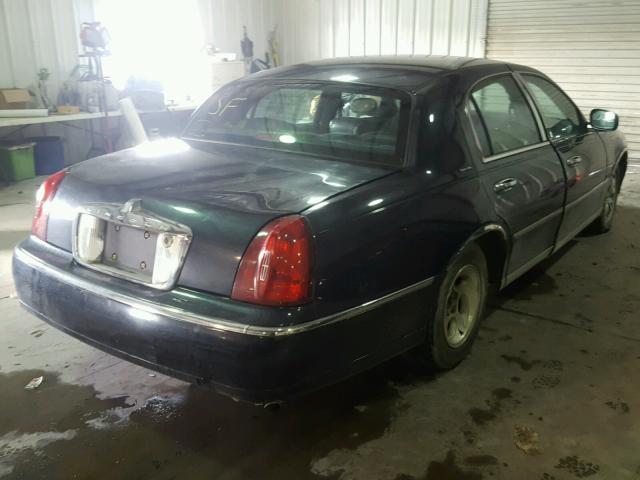 1LNHM82W1XY631743 - 1999 LINCOLN TOWN CAR S BLUE photo 4