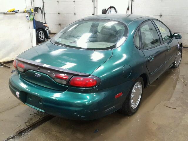 1FAFP53S6XG172637 - 1999 FORD TAURUS SE GREEN photo 4