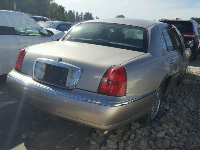 1LNHM81W7XY660763 - 1999 LINCOLN TOWN CAR E GRAY photo 4